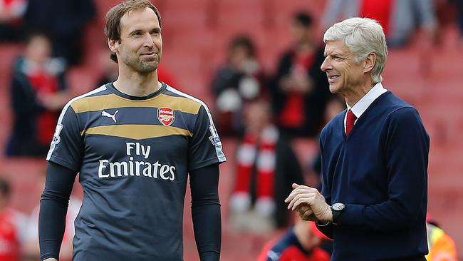 Petr Cech (L) stands with Arsenal's manager Arsene Wenger.