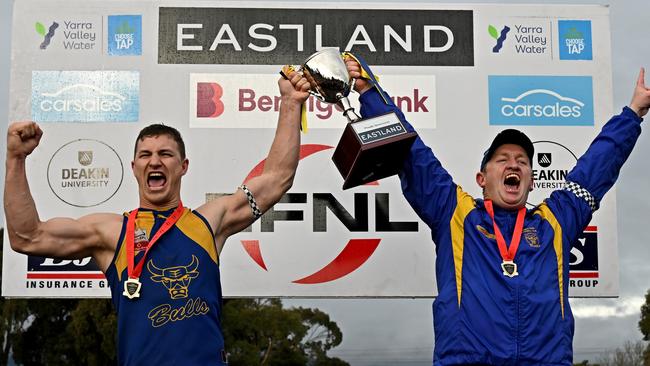 Kyle Martin and coach Steve Hughes lift the 2022 EFNL Premier Division cup. Picture: Andy Brownbill