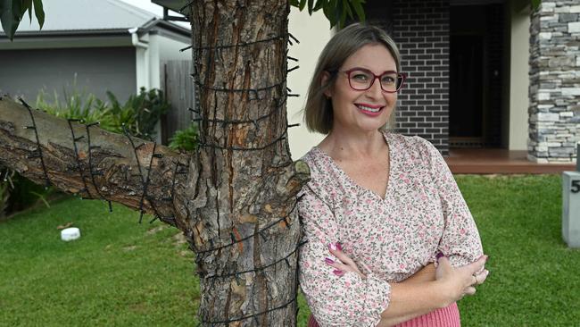 15/5/2025: Amber Warke, with Oliver the dog, outside her home in Ripley, Brisbane. The mum of two mis hoping for a rate cut to help cut down on the cost of living. pic: Lyndon Mechielsen/Courier Mail