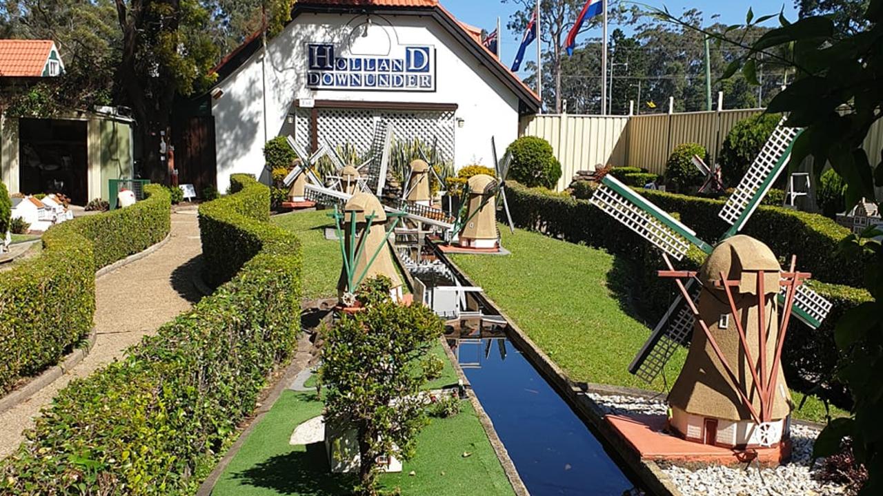 Windmills and water features provide a frame for The Clog Barn Dutch village.