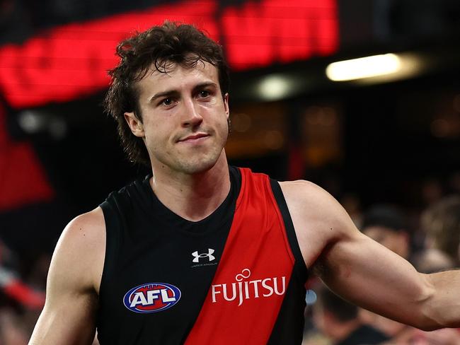 MELBOURNE, AUSTRALIA - MARCH 30: Andrew McGrath of the Bombers high fives fans after winning the round three AFL match between Essendon Bombers and St Kilda Saints at Marvel Stadium, on March 30, 2024, in Melbourne, Australia. (Photo by Quinn Rooney/Getty Images)