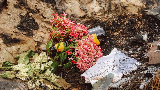 Flowers, Notes and beers left at the site of a Treble fatal accident on Hillier Rd, Howard Springs. Picture: Glenn Campbell