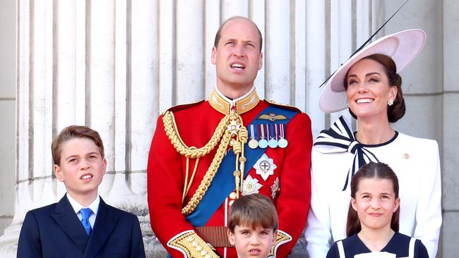 LONDON, ENGLAND - JUNE 15: (L-R) Prince George of Wales, Prince William, Prince of Wales, Prince Louis of Wales, Catherine, Princess of Wales and Princess Charlotte of Wales on the balcony during Trooping the Colour at Buckingham Palace on June 15, 2024 in London, England. Trooping the Colour is a ceremonial parade celebrating the official birthday of the British Monarch. The event features over 1,400 soldiers and officers, accompanied by 200 horses. More than 400 musicians from ten different bands and Corps of Drums march and perform in perfect harmony. (Photo by Chris Jackson/Getty Images)