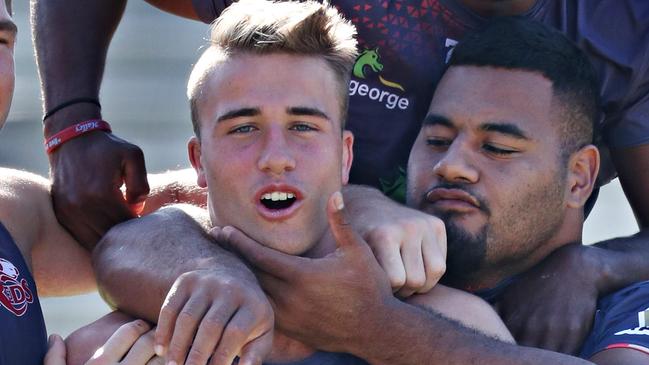 Reds players wearing club and school socks as grassroots rugby salute...set up for C-Mail only Taniela Tupou, Hamish Stewart, Moses Sorovi and Angus Scott-Young at Ballymore before team training.Pic Annette Dew