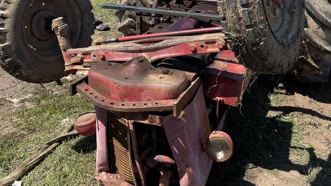 An overturned tractor on Lemnos North Road near Shepparton. The tractor fell on a man on Friday, March 18. Photo: Sarah Buckley