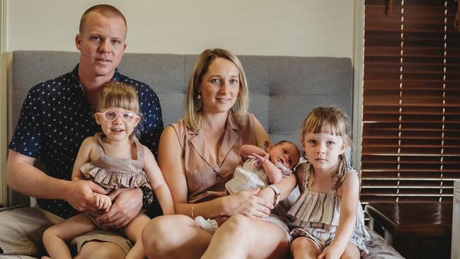 The Flynn family – Ben Flynn holding Harper, mum Michelle with Madison and eldest daughter Hayley. Picture: Deane Woods photography