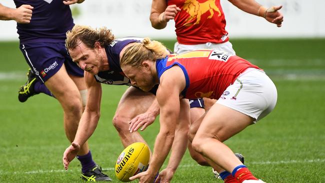 Daniel Rich (right) battles with Fremantle’s David Mundy at Optus Stadium. Picture: Daniel Carson/AFL Photos via Getty Images