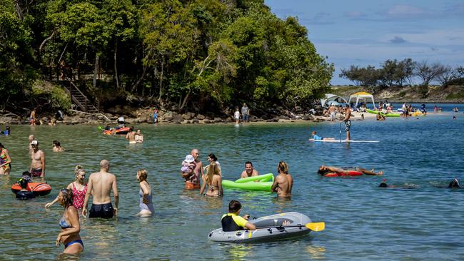 People cooling off at Tallebudgera Creek during a hot summers day on the Gold Coast. Picture: Jerad Williams