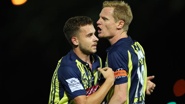 Matt Simon is restrained by teammate Jordan Murray. Picture: Getty