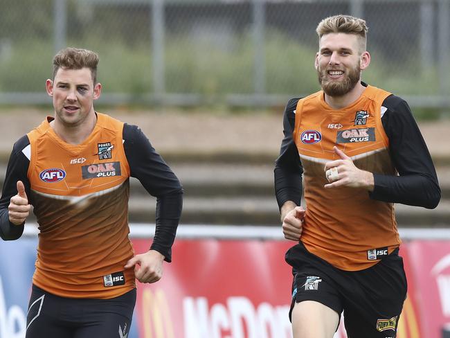 Port Adelaide Training at Alberton Oval. Brett Eddy and Jackson Trengove run laps. Picture Sarah Reed