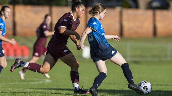 QAS captain Ellen Gett attempts to stop a pass earlier in her career. Picture: Kevin Farmer