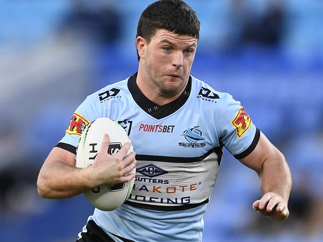 GOLD COAST, AUSTRALIA - JULY 04: Chad Townsend of the Sharks runs the ball during the round eight NRL match between the Gold Coast Titans and the Cronulla Sharks at Cbus Super Stadium on July 04, 2020 in Gold Coast, Australia. (Photo by Ian Hitchcock/Getty Images)