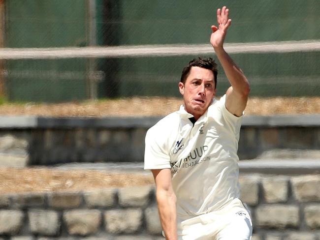 Andrew Perrin goes searching for a wicket. Picture: Hamish Blair