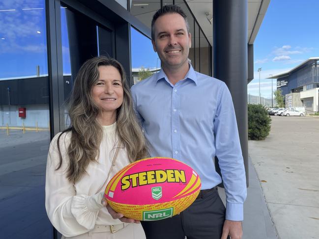 Wholesale bakery business Jean-Pierre CEO Sylvie Danoy with Townsville MP Adam Baillie with a Women in Manufacturing Round game ball.