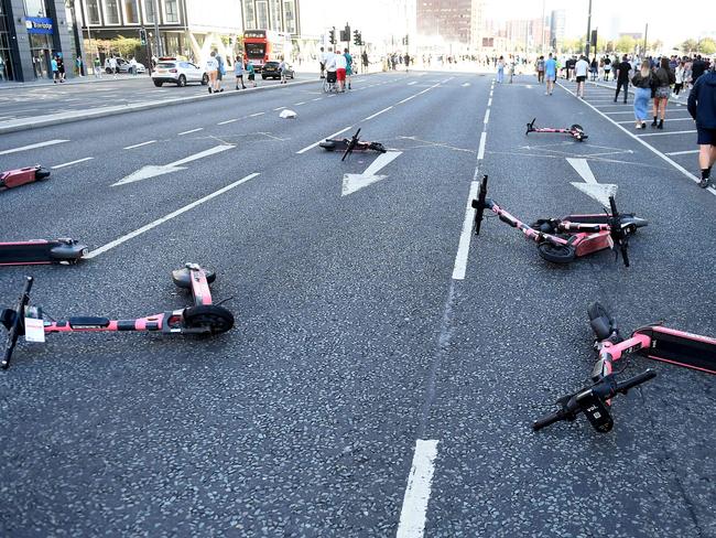 Electric scooters are strewn across the road during the 'Enough is Enough' demonstration outside the Liver Building in Liverpool on August 3, 2024. Picture: AFP.