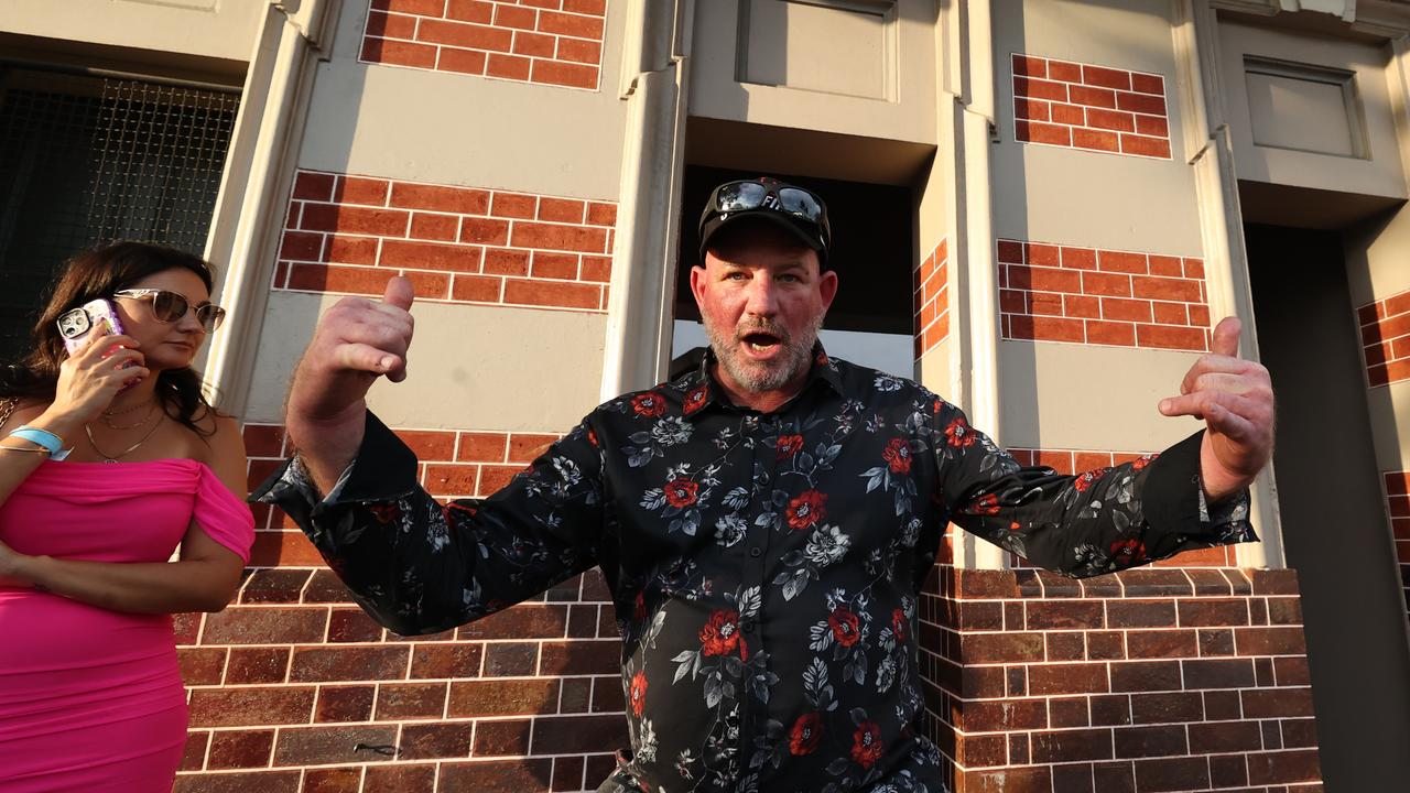 Punters leave Eagle Farm racecourse on Melbourne Cup Day.