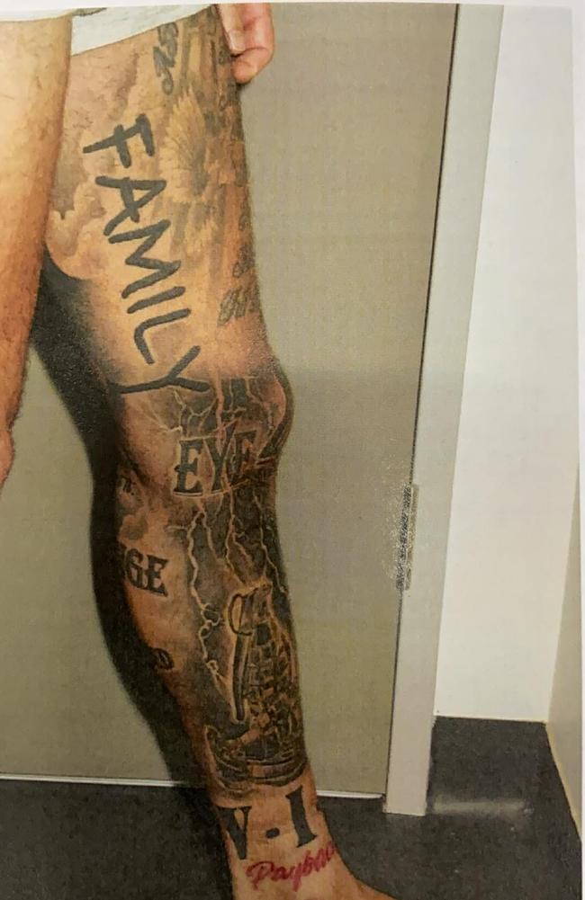 Abdul Abu-Mahmoud “eye for an eye” and “family” tattoo on his leg.