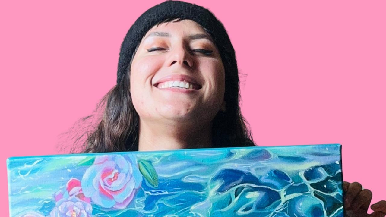 Tasmanian artist Brandi Salmon with a painting she did for pop superstar Lorde. Picture: Supplied