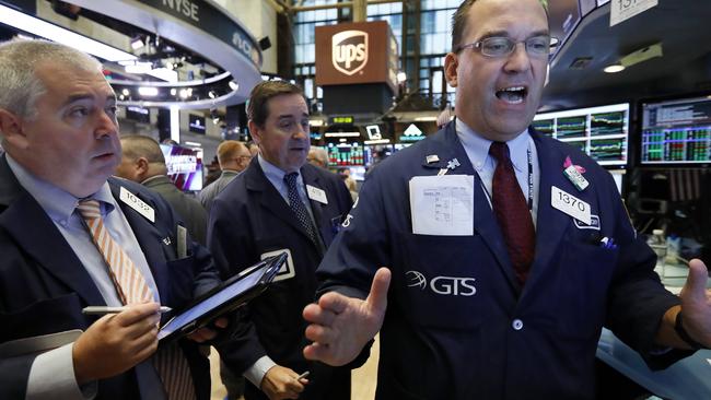 Trader Edward McCarthy, left, and specialist Anthony Matesic, right, work on the floor of the New York Stock Exchange, Friday, Sept. 14, 2018. Picture: AP