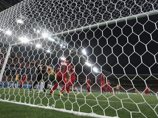 Matt McKay gives the Socceroos an early lead against Oman.