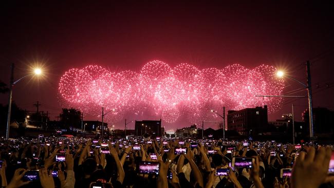 The People watch fireworks during a massive parade to celebrate the 70th anniversary of the founding of the People's Republic of China, in Beijing October 1, 2019. (Photo by Wang He/Getty Images)