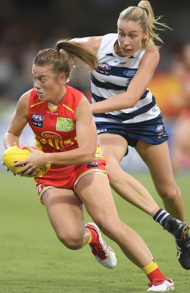 Jamie Stanton of the Suns handles the ball during the round five AFLW match between the Gold Coast Suns and the Geelong Cats at Great Barrier Reef Arena on March 06, 2020 in Mackay, Australia. Picture: Albert Perez