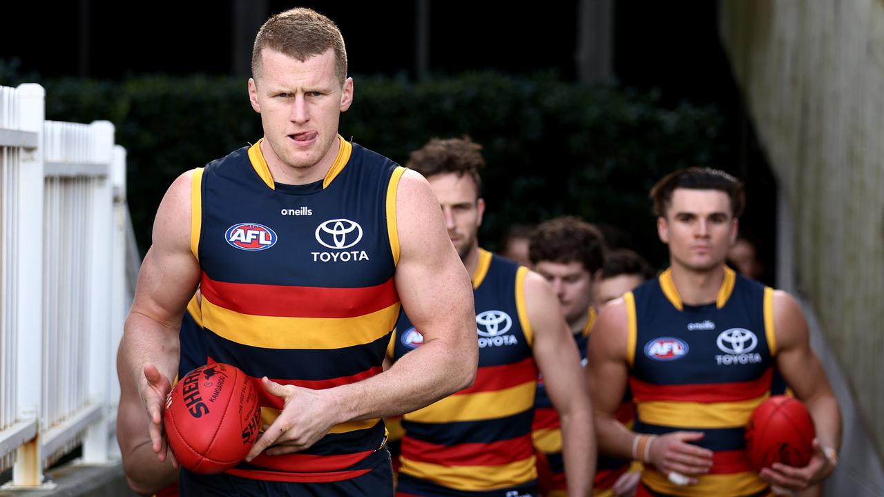 Riley O’Brien leads the Crows out of the race. Picture: Getty Images