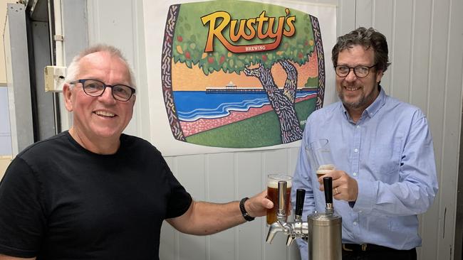 Victor Nicholls and Russell Gee of Rusty's Brewing Company celebrate Brisbane City Council's decision to approve their application for a microbrewery at Sandgate. Picture: Michelle Smith