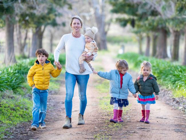 BOWNA, AUSTRALIA - The Australian. 13 July 2022 : Freelance writer Virginia Tapscott from Bowna near Albury. Virginia has written a very personal piece about her decision to be a stay at home mum, and how she feels she is undervalued for the work she puts in. Pictured with her children Tully 8mths, Oscar 6yrs, Elke 4yrs, and Eva 2yrs.Photo by - Simon Dallinger