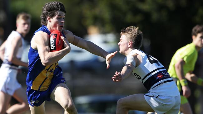 Josh Honey fends off Tom McMahon.