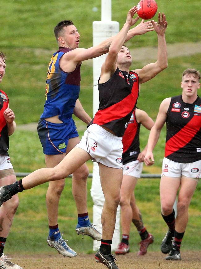 NFL: Eltham’s Lane Sinclair marks in front of Jack Langford of Banyule. Picture: Hamish Blair