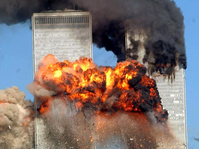 NEW YORK - SEPTEMBER 11, 2001: (FILE PHOTO) A fiery blasts rocks the south tower of the World Trade Center as the hijacked United Airlines Flight 175 from Boston crashes into the building September 11, 2001 in New York City. Almost two years after the September 11 attack on the World Trade Center, the New York Port Authority is releasing transcripts on August 28, 2003 of emergency calls made from inside the twin towers. (Photo by Spencer Platt/Getty Images)