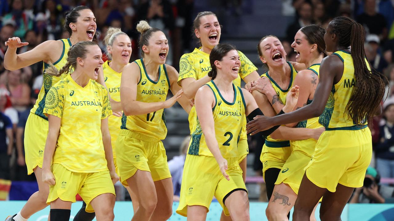 Australia celebrates the win. Photo by Thomas COEX / AFP