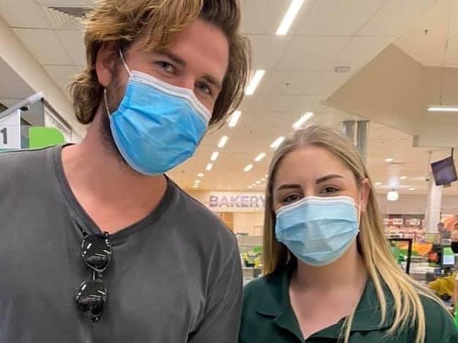 Liam Hemsworth with a fan an hour ago at Woolies supermarket in Kiama today on August 13, 2021