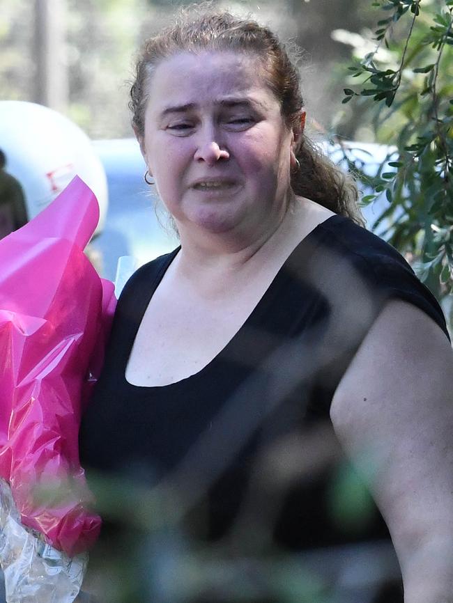 Both families laid flowers. Picture: Simon Bullard.