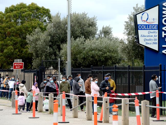 People queue for COVID vaccination at a clinic set up at Al-Taqwa College in Truganina. Picture: Andrew Henshaw