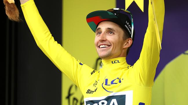 Hindley celebrates at podium as yellow leader jersey winner. Picture: Getty