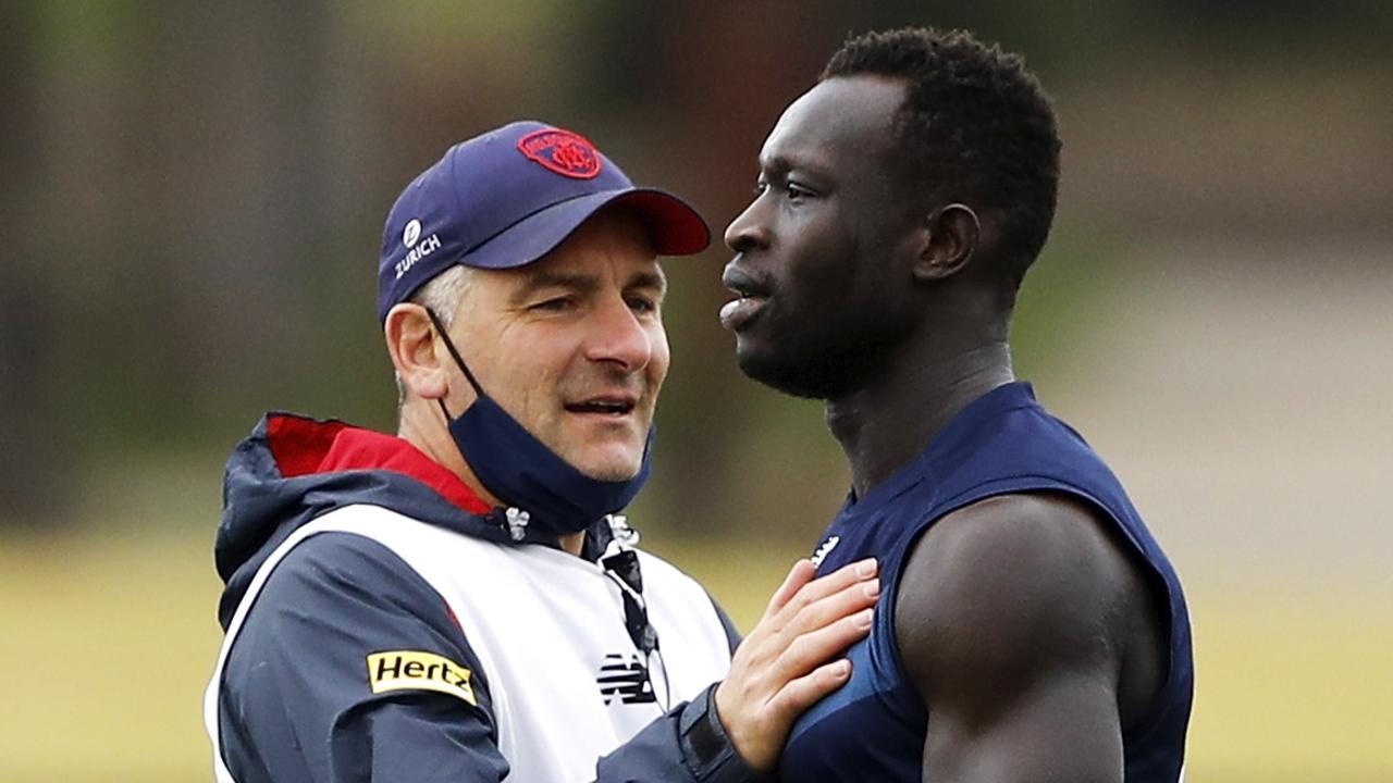 Midfield coach Adem Yze chats with Majak Daw. Picture: Dylan Burns