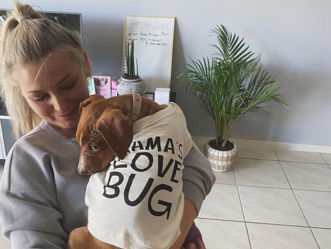 Bowen Collinsville Pet Rescue foster carer Nicole Rouse with dog Maddie, who she rescued after she was found in a cane field with broken leg and scratched face. Photo: Contributed