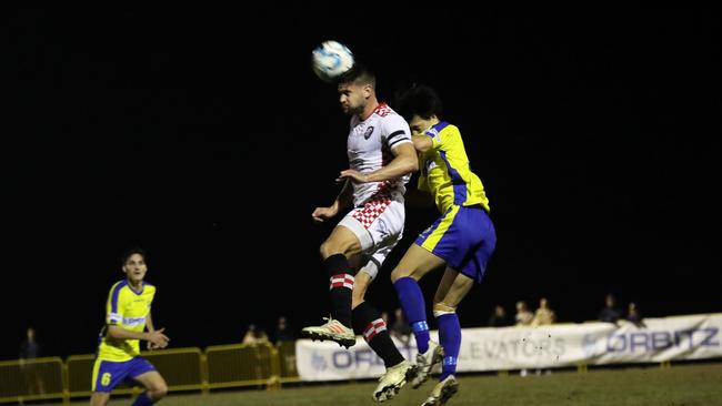 Gold Coast United and Gold Coast Knights played out a 2-2 draw in Round 22 of the NPL Qld competition at Coplick Family Sports Park, tallebudgera, on Tuesday, July 2, 2019. Pictured is Knighs player Sam Smith (left) and United player Junya Yabe. Picture credit: Sportspics.