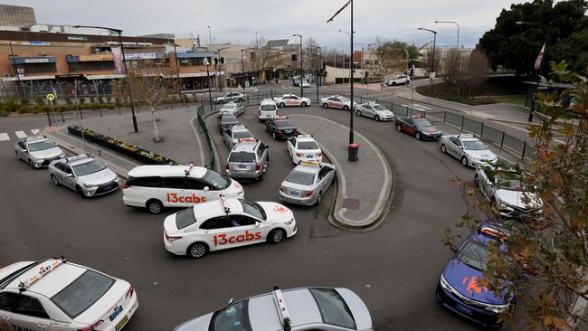 A long queue of taxis wait near Blacktown train station to pick up customers. Picture: Damian Shaw