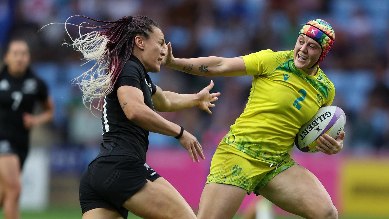 Australia's Charlotte Caslick runs away to score during their Women's Rugby  Sevens preliminary match against Fiji at Deodoro Stadium on day one, of the  Rio 2016 Olympic Games in Rio de Janeiro