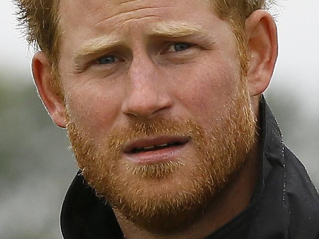 Britain's Prince Harry walks at Goodwood Aerodrome in Goodwood, southern England, on September 15, 2015, ahead of a flypast by Spitfire and Hurricane aircraft to commemorate the 75th anniversary of the Battle of Britain, a battle fought predominantly in the air, during World War II (WWII). AFP PHOTO / KIRSTY WIGGLESWORTH / POOL