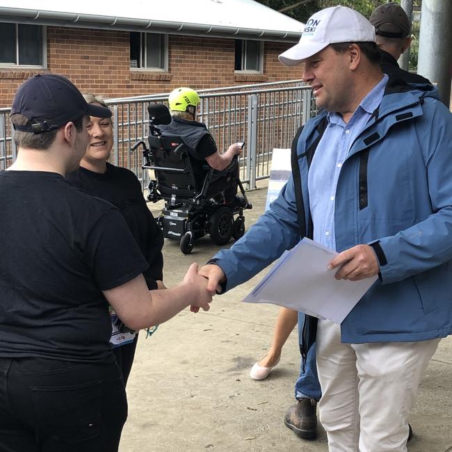 Mackellar Liberal MP Jason Falinski greeting voters on federal election day at Narraweena Public School. Picture: Jim O'Rourke