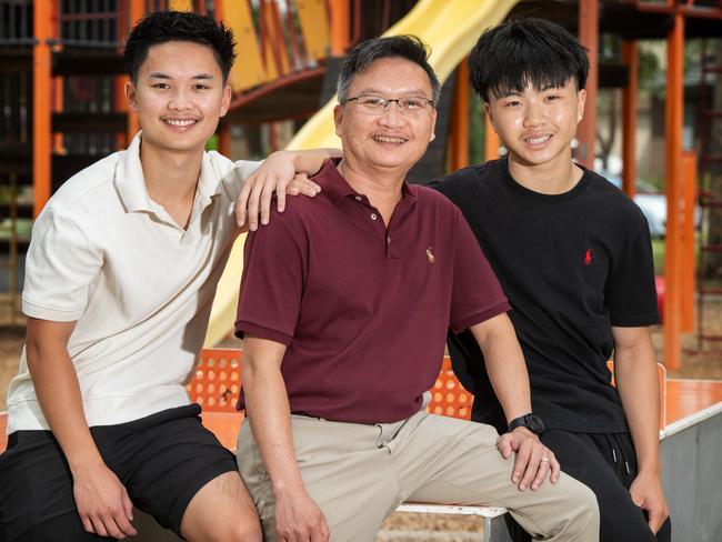 Stan Nguyen with his sons Daniel, 20, and Aaron, 16. Picture: Tony Gough