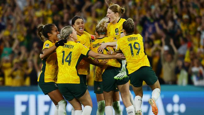 Matildas players celebrate winning the FIFA Womens World Cup Quarter final match between against France at Brisbane Stadium. Picture: Lachie Millard