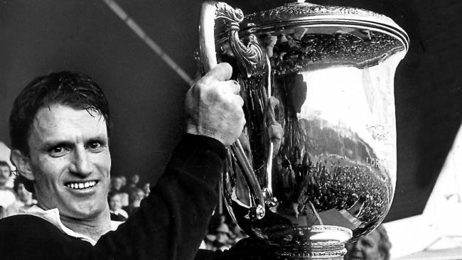 Andrew Slack holds the Bledisloe Cup after the Wallabies defeated the All Blacks at Eden Park in 1986. Picture: Ross Setford