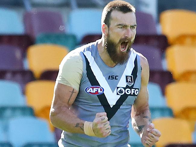 BRISBANE, AUSTRALIA - JULY 19: Charlie Dixon of the Power celebrates a goal during the round 7 AFL match between the Carlton Blues and the Port Adelaide Power at The Gabba on July 19, 2020 in Brisbane, Australia. (Photo by Jono Searle/AFL Photos/via Getty Images)