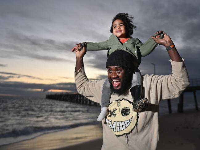 19/5/24. Jurgen Boahen-Oteng with his daughter Eris - 2 at Port Noarlunga Beach. (from St Agnes 0470 560 514). Picture: Keryn Stevens