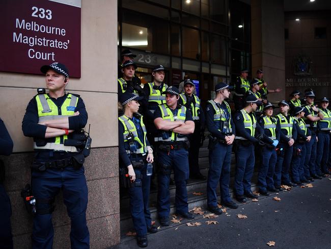 There is a large police presence outside court. Picture: Jake Nowakowski